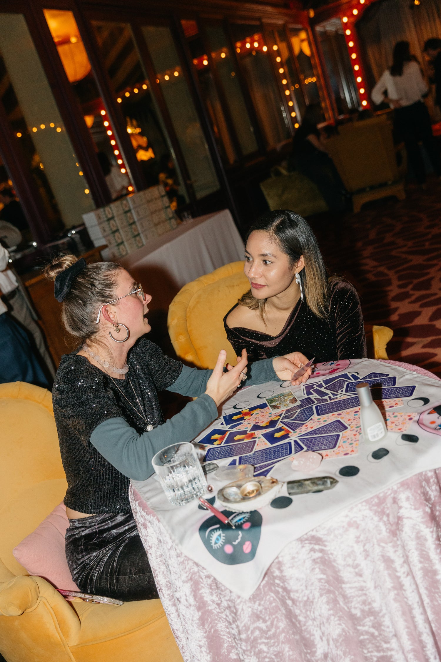 Guests enjoying a tarot reading during a corporate event